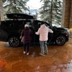 Family getting into suburban at Westin Riverfront in Avon CO.