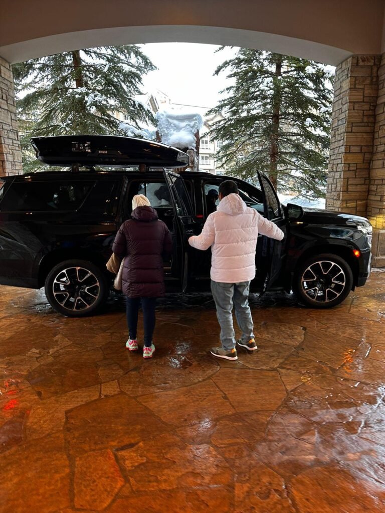 Family getting into suburban at Westin Riverfront in Avon CO.