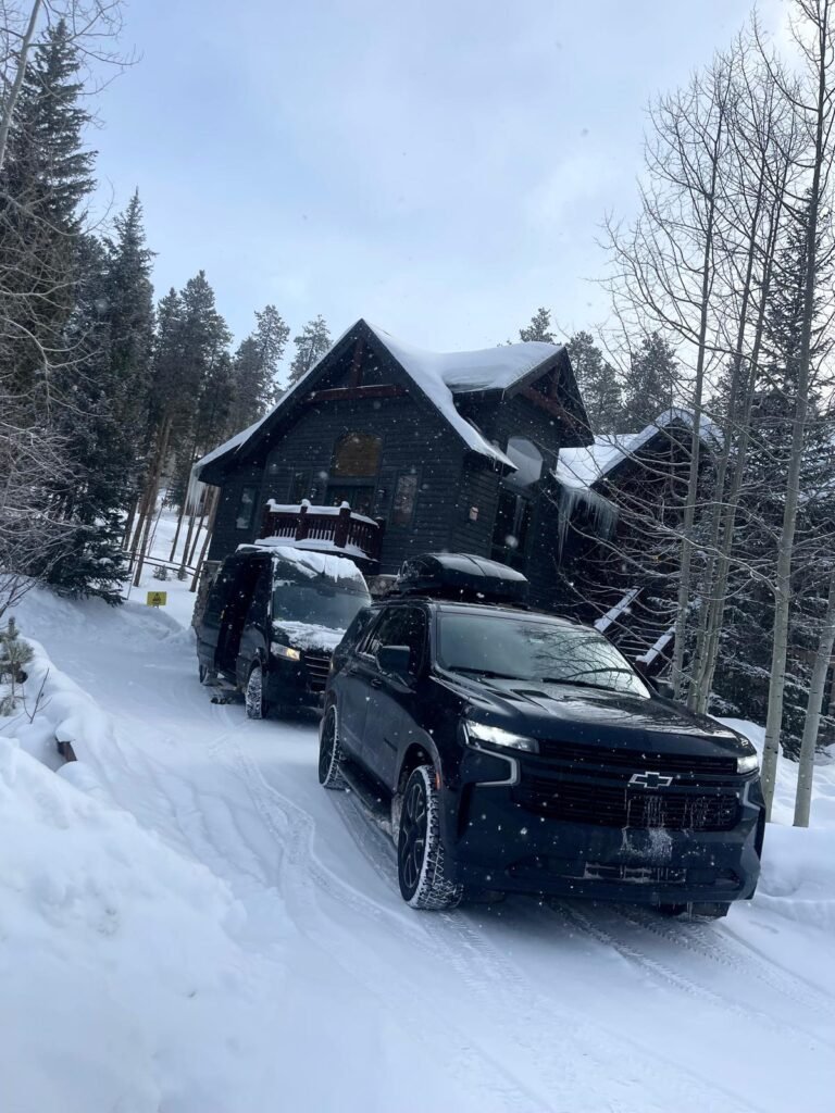 Suv & Sprinter picking up passengers at Vail Rental.