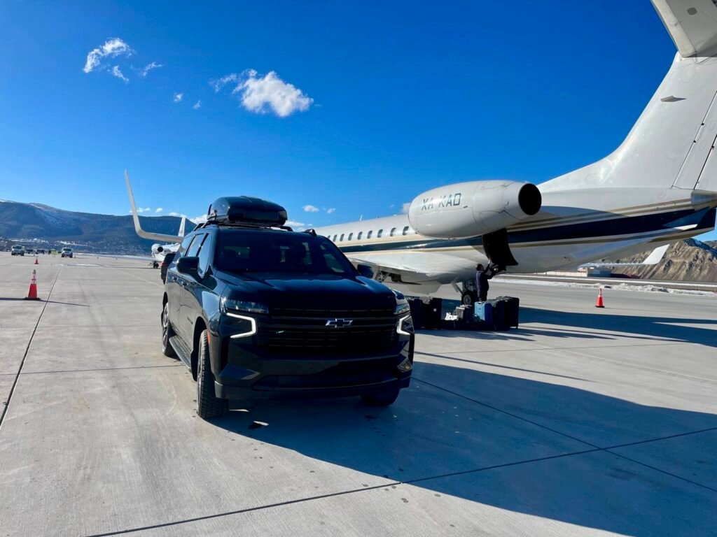 Premier Suv on tarmac at vail valley jet center fbo for pickup
